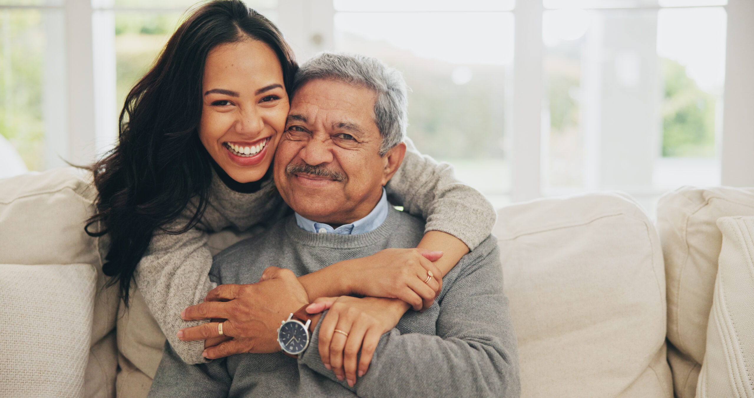 Hug, Portrait And Smile Of Old Man With Daughter On Sofa In Living Room Of Home For Bonding Or Visit Face, Family Or Love With Happy Woman And Senior Father Embracing In Apartment Together Hug, Portrait And Smile Of Old Man With Daughter On Sofa In Living Room Of Home For Bonding Or Visit Face, Family Or Love With Happy Woman And Senior Father Embracing In Apartment Together